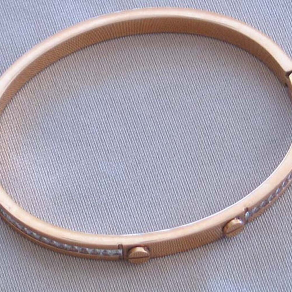 Elegant Stainless Steel Gold Plated Bangle Bracelet Enhanced By Zircons.   NEW